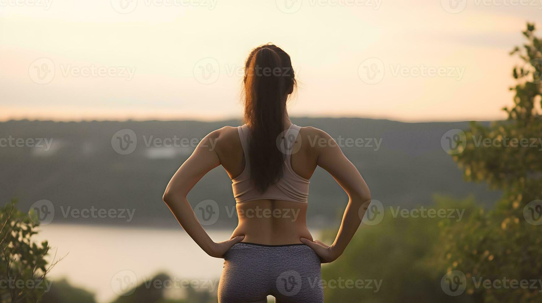 Back view. sporty and happy woman. looks at the view in front of her and rests after long run outdoors. generative ai photo