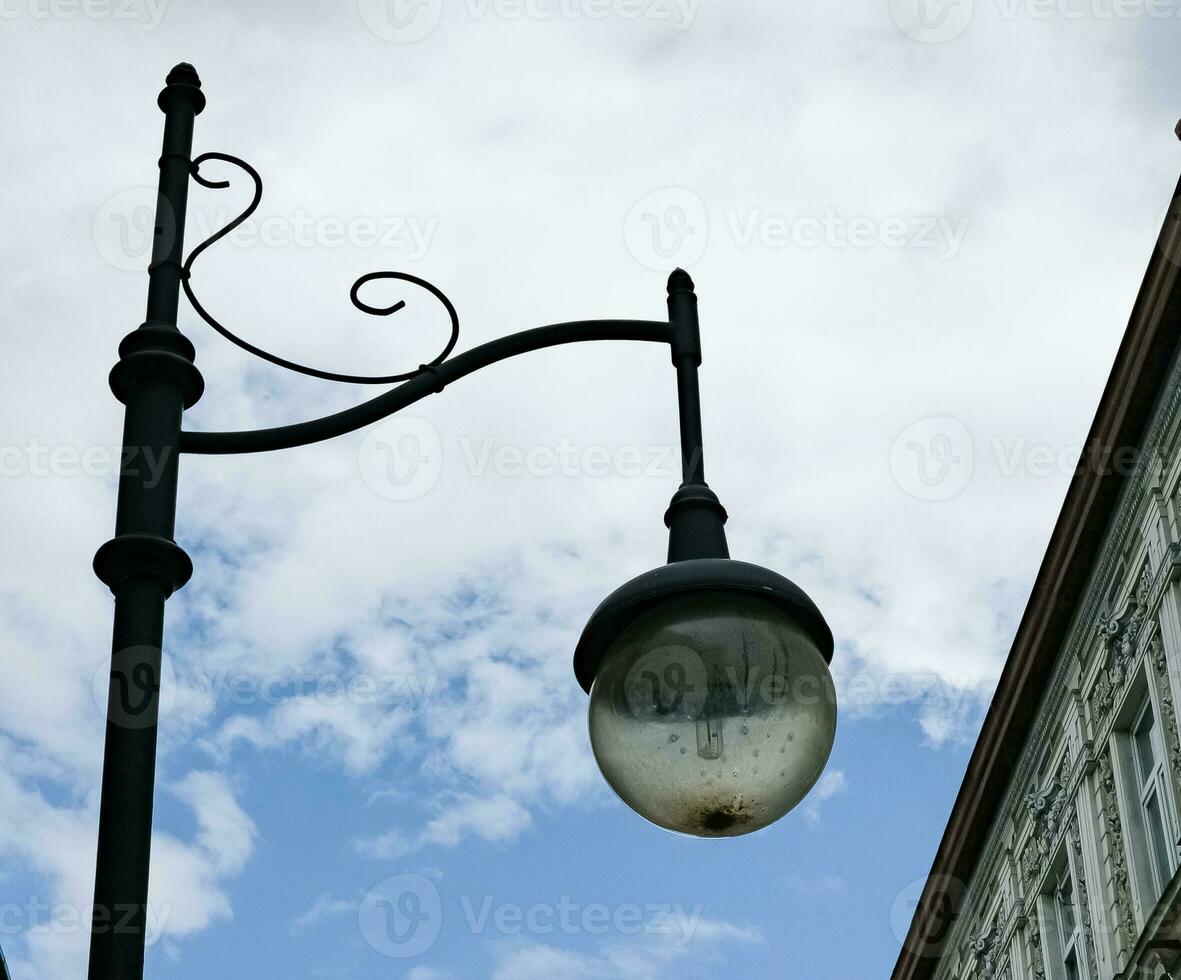 Retro lantern on the background of the blue sky. vintage lantern. A street lantern. photo