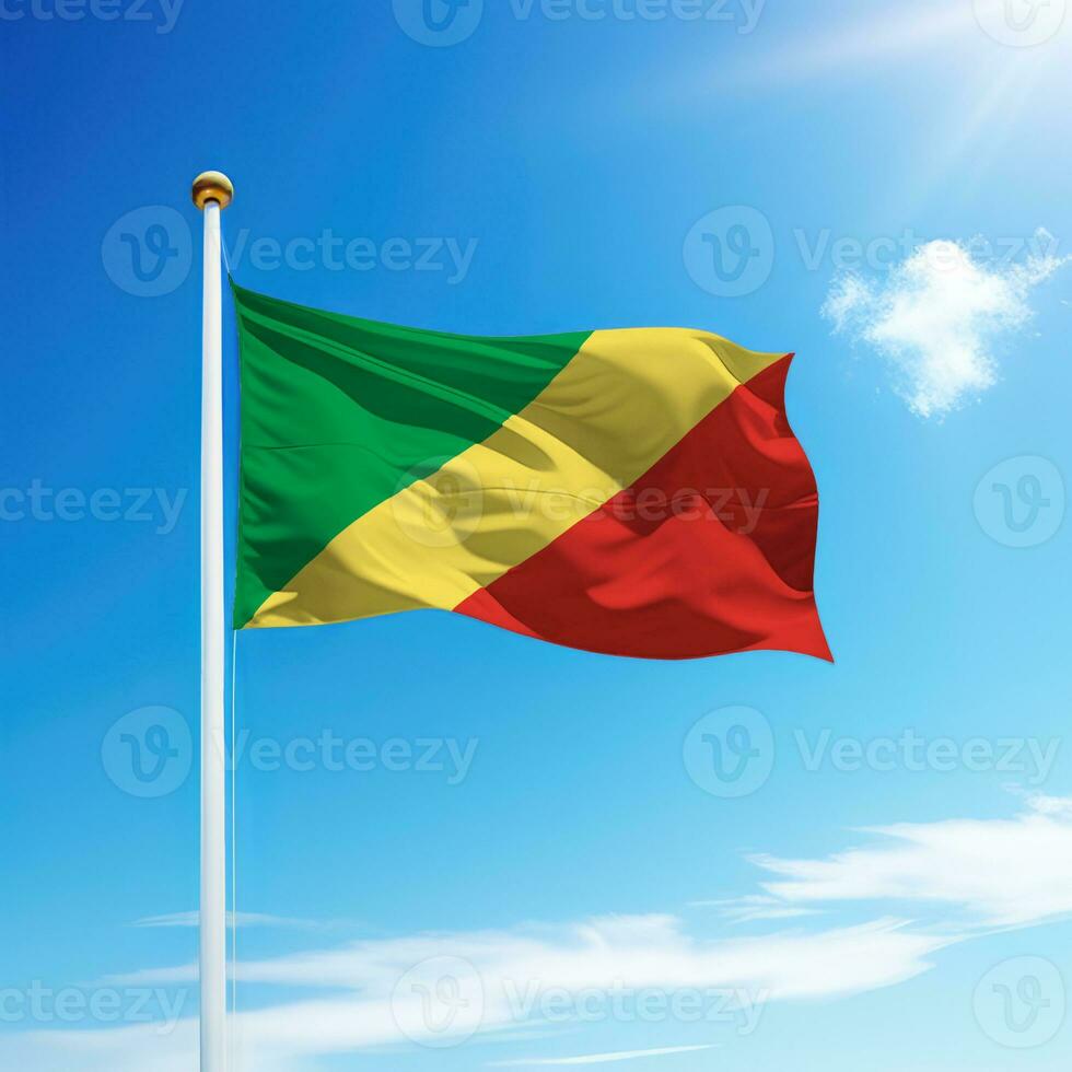 Waving flag of Congo on flagpole with sky background. photo