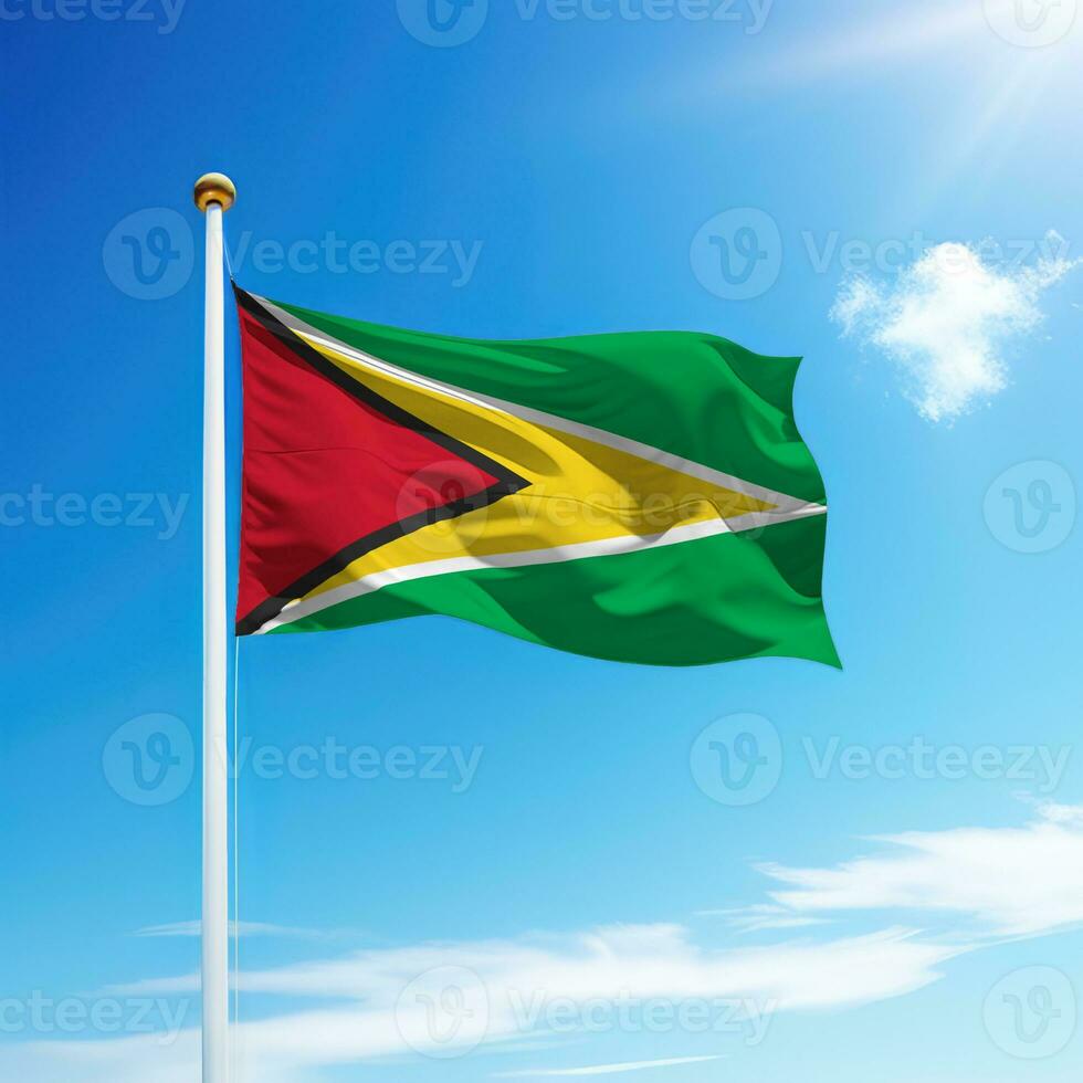 Waving flag of Guyana on flagpole with sky background. photo