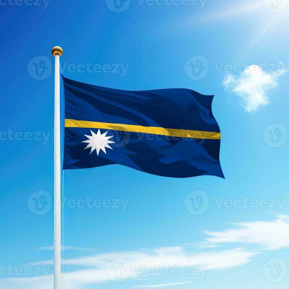 Waving flag of Nauru on flagpole with sky background. photo