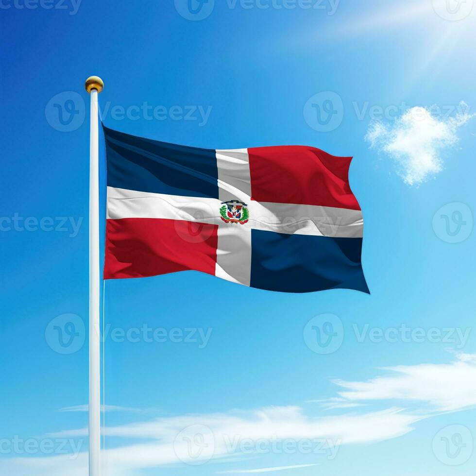 Waving flag of Dominican Republic on flagpole with sky background. photo