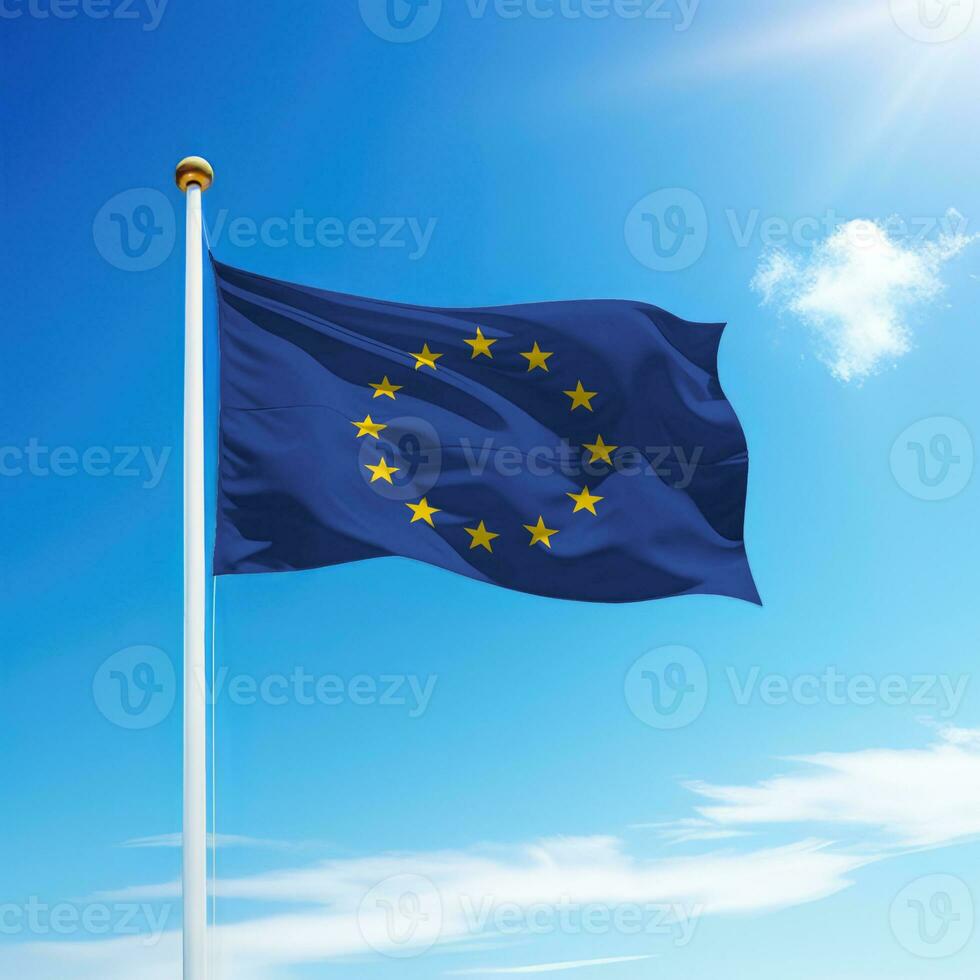Waving flag of European Union on flagpole with sky background. photo