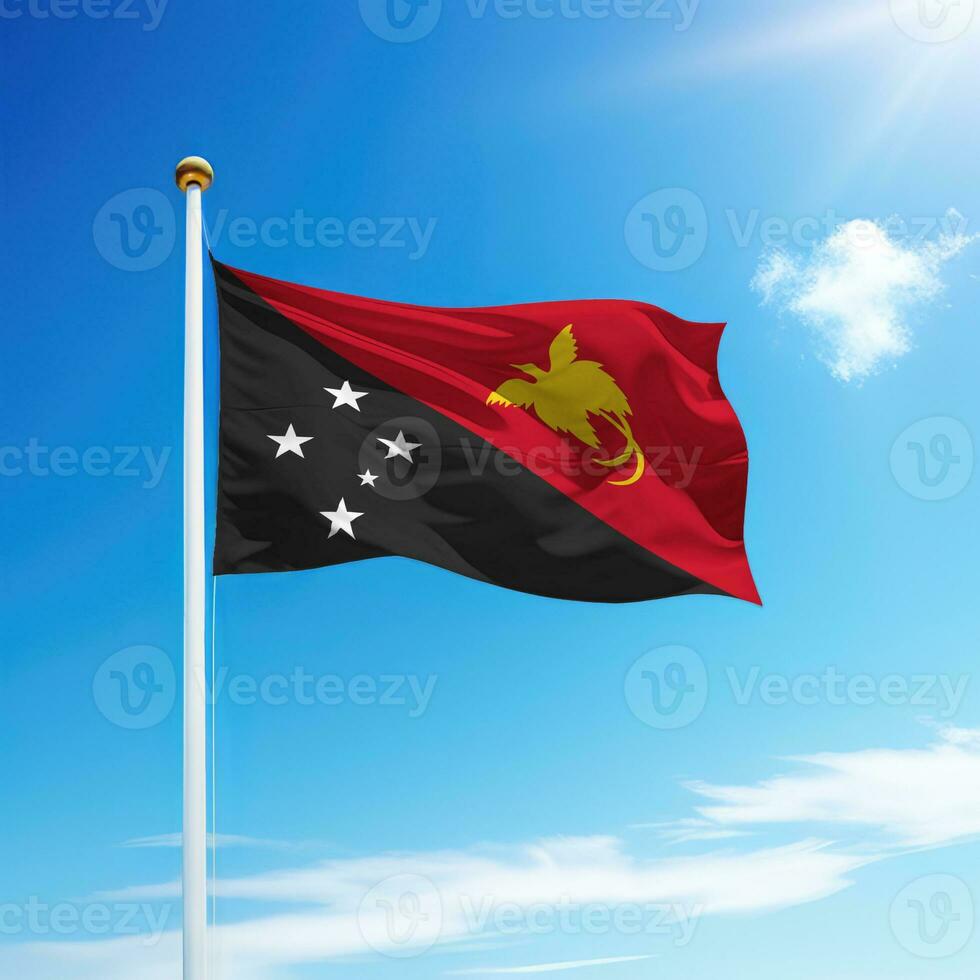 Waving flag of Papua New Guinea on flagpole with sky background. photo