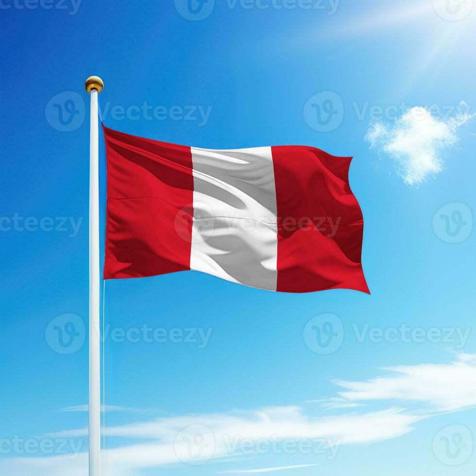 Waving flag of Peru on flagpole with sky background. photo