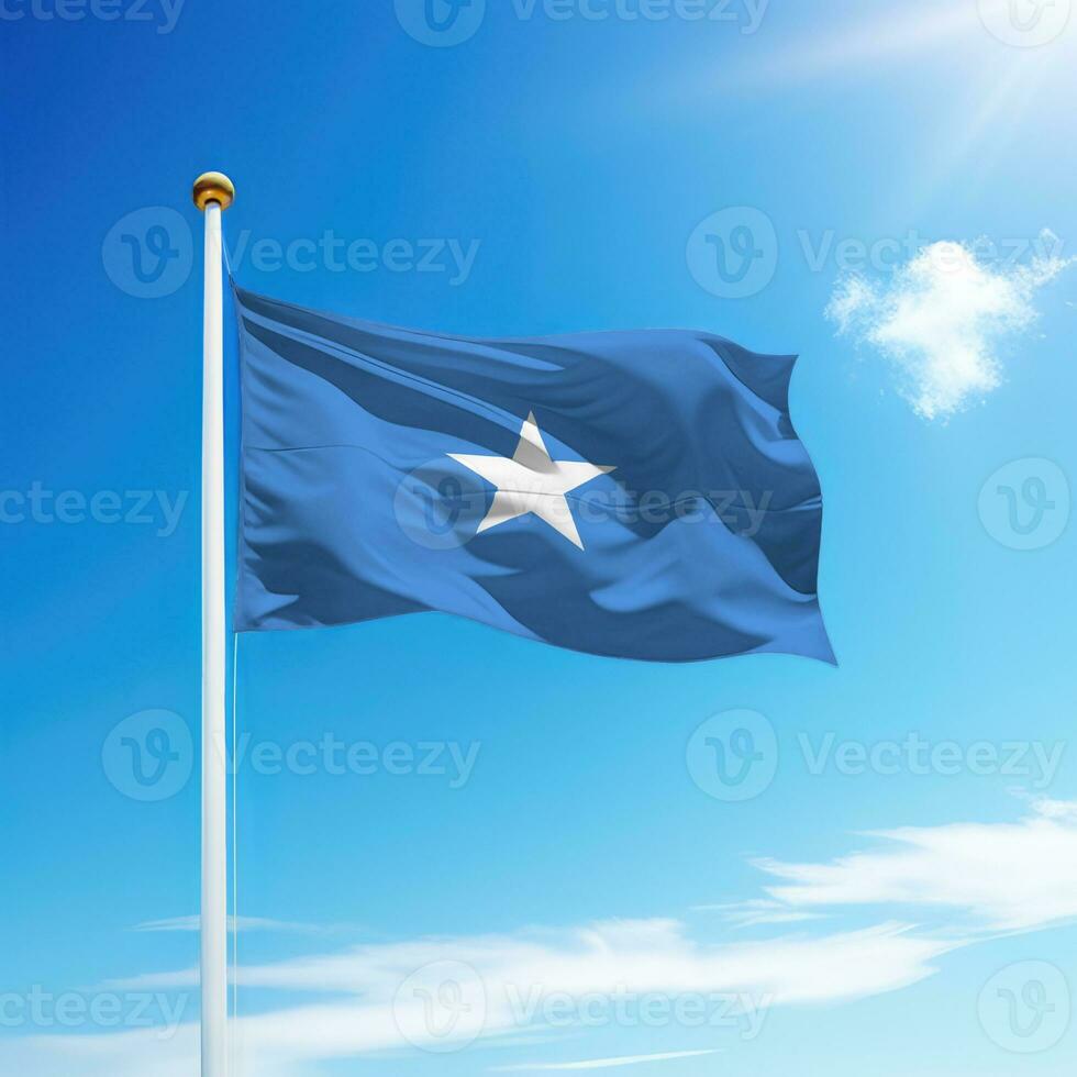 Waving flag of Somalia on flagpole with sky background. photo