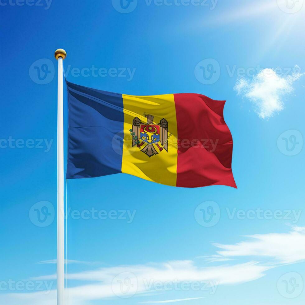 Waving flag of Moldova on flagpole with sky background. photo