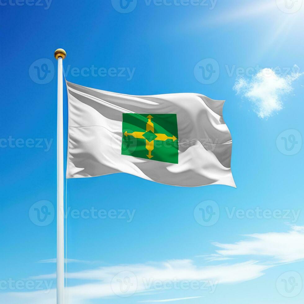 Waving flag of Distrito Federal is a state of Brazil on flagpole photo