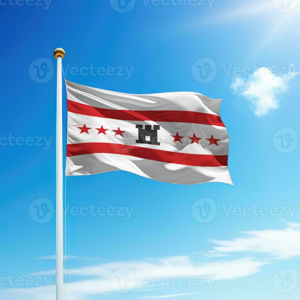 Waving flag of Drenthe is a state of Netherlands on flagpole photo