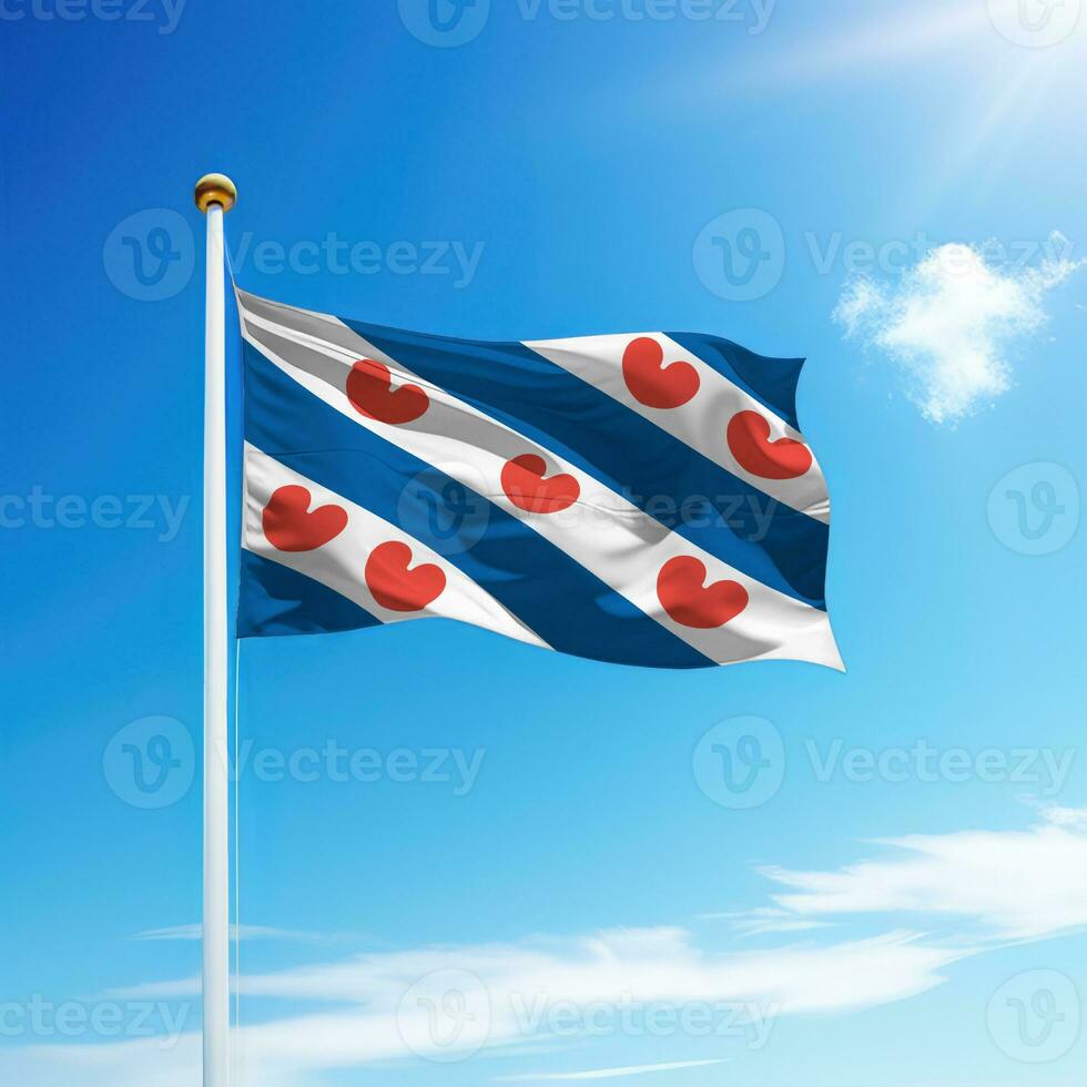 Waving flag of Friesland is a state of Netherlands on flagpole photo