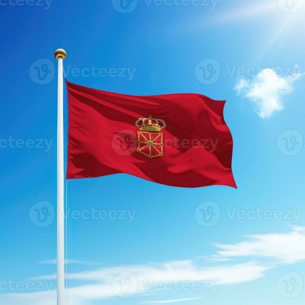 Waving flag of Navarre is a community of Spain on flagpole photo