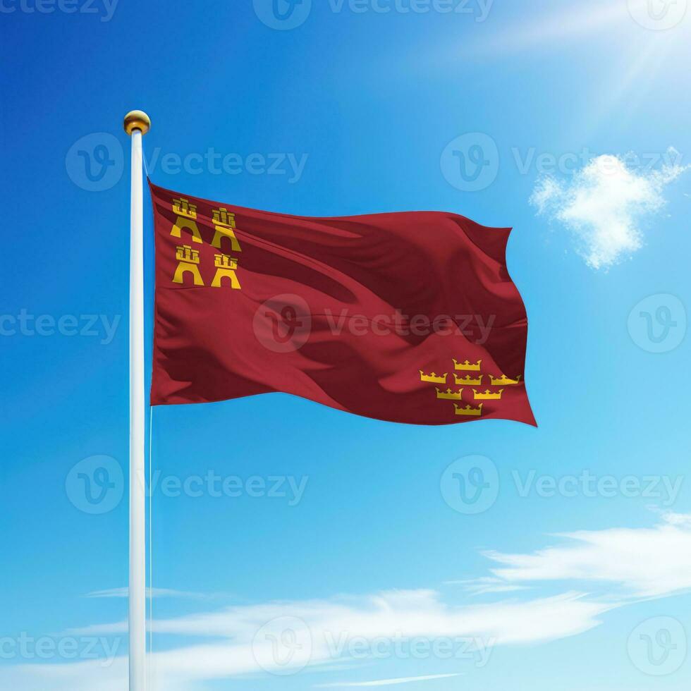 Waving flag of Murcia is a community of Spain on flagpole photo