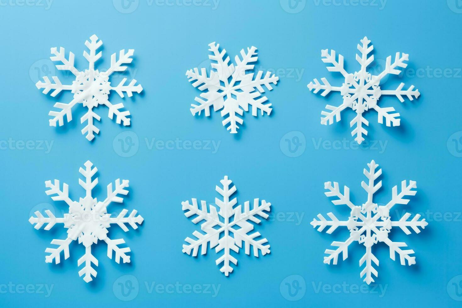 Detailed shot of DIY snowflakes on New Year isolated on a gradient background photo