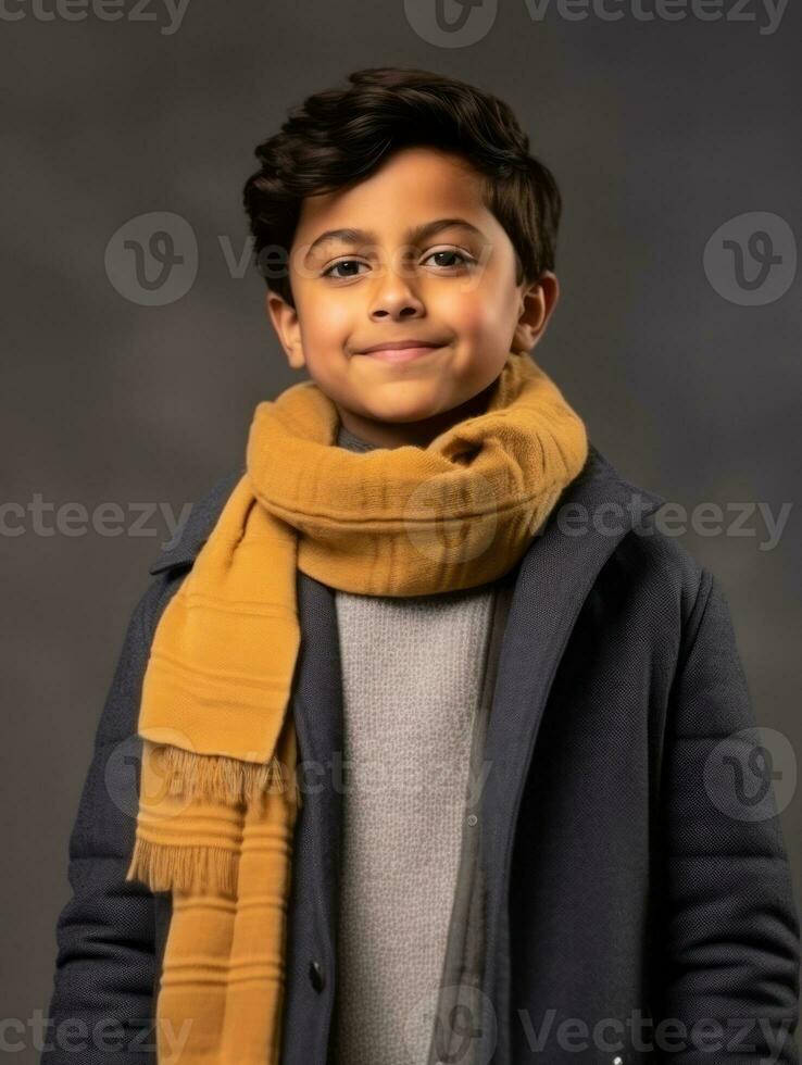 Happy Indian kid in casual clothing against a neutral background AI Generative photo