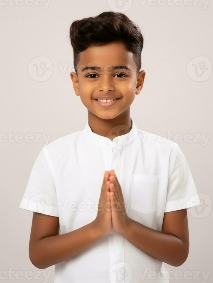 Happy Indian kid in casual clothing against a neutral background AI Generative photo