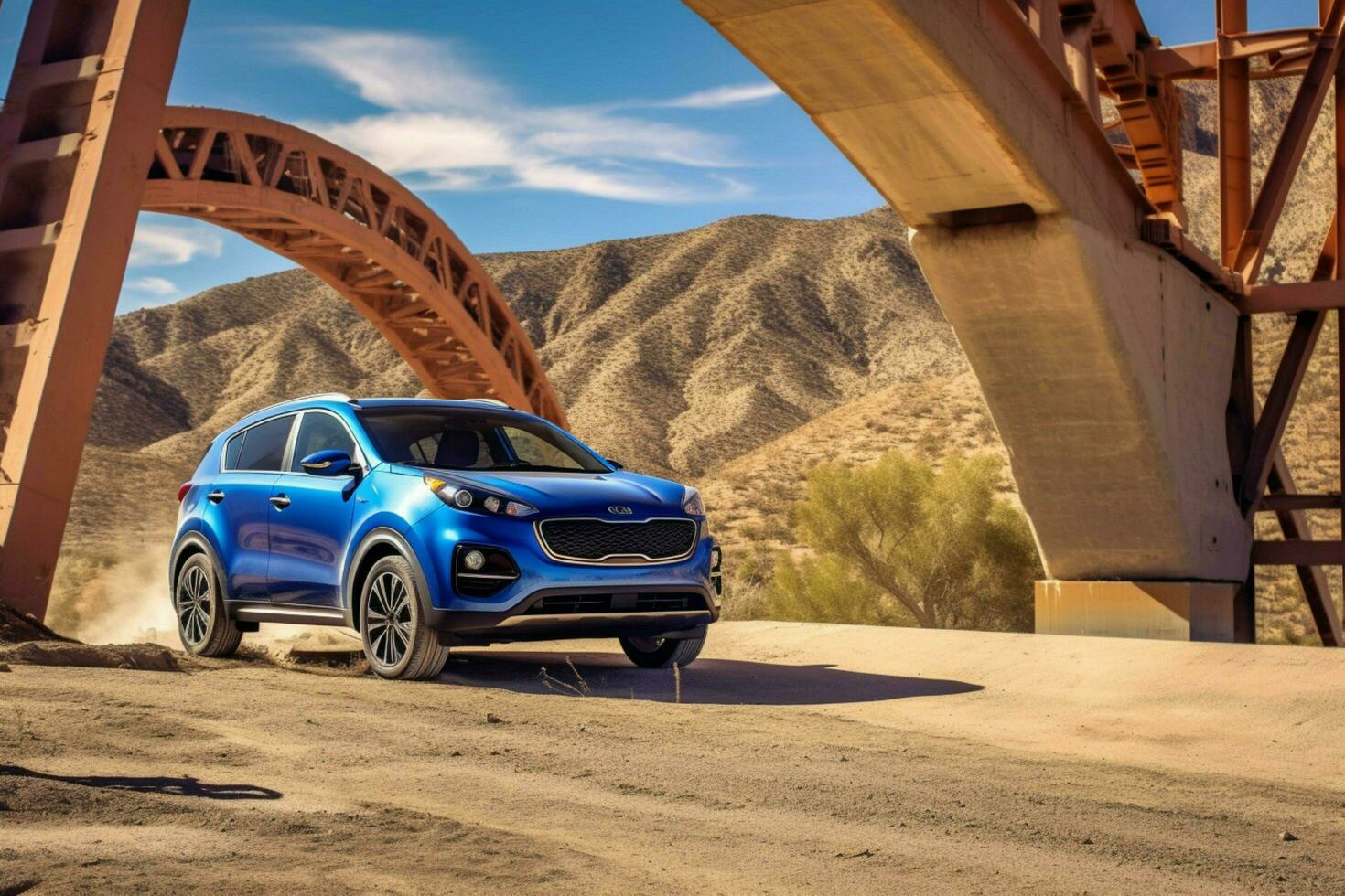 a blue kia sportage is parked under a bridge in t photo