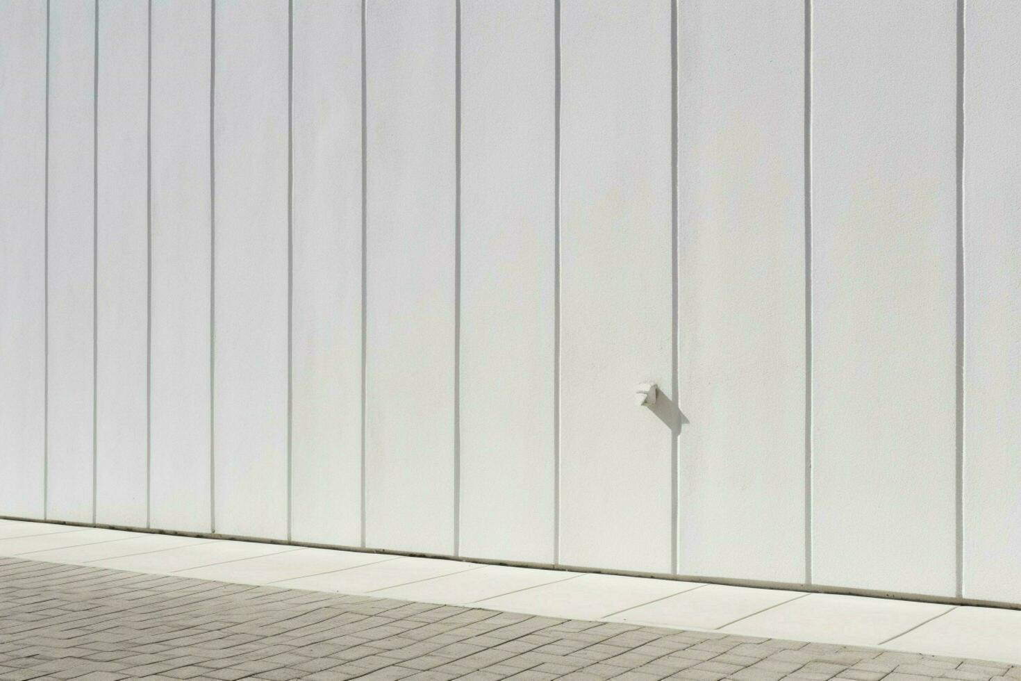 a wall with a white background and a line of lines photo