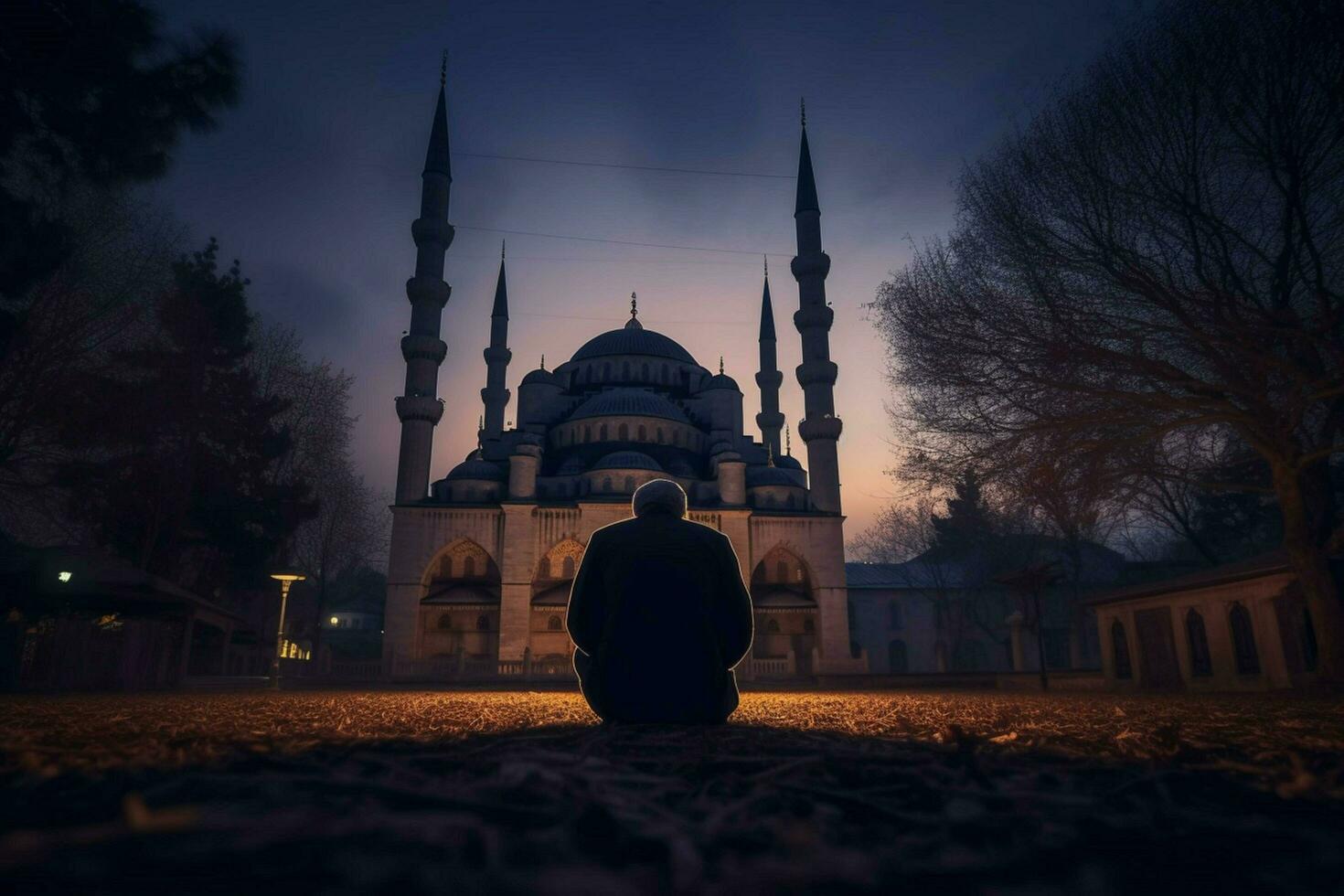 Orando a el azul mezquita a oscuridad foto