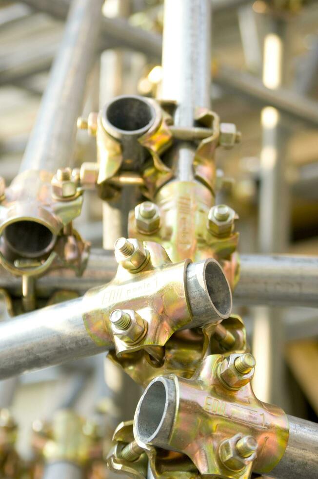 a pile of metal clips and nuts in a pile photo