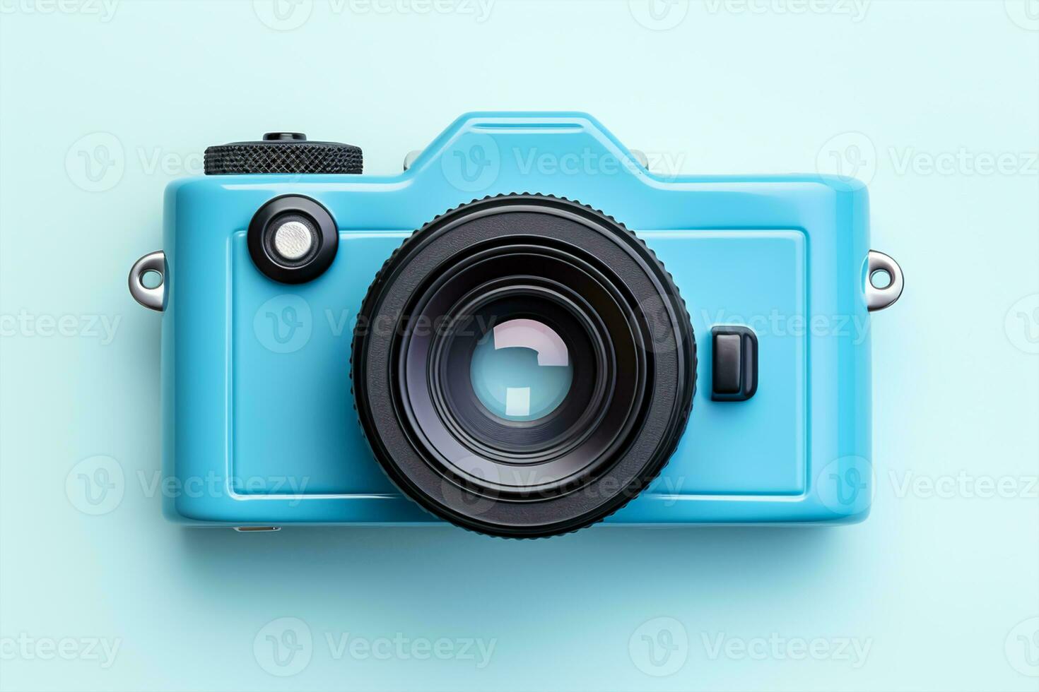 Vintage film camera on blue background. Top view with copy space photo