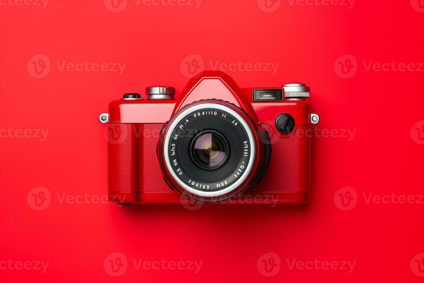 Retro camera isolated on red background. Flat lay, top view photo