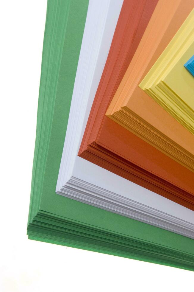 a stack of colored paper with a white background photo