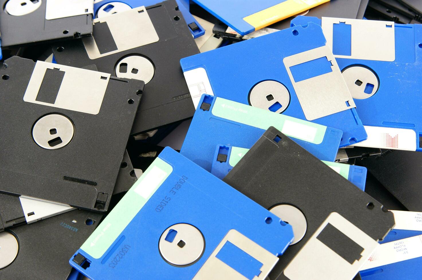 a pile of floppy disks photo