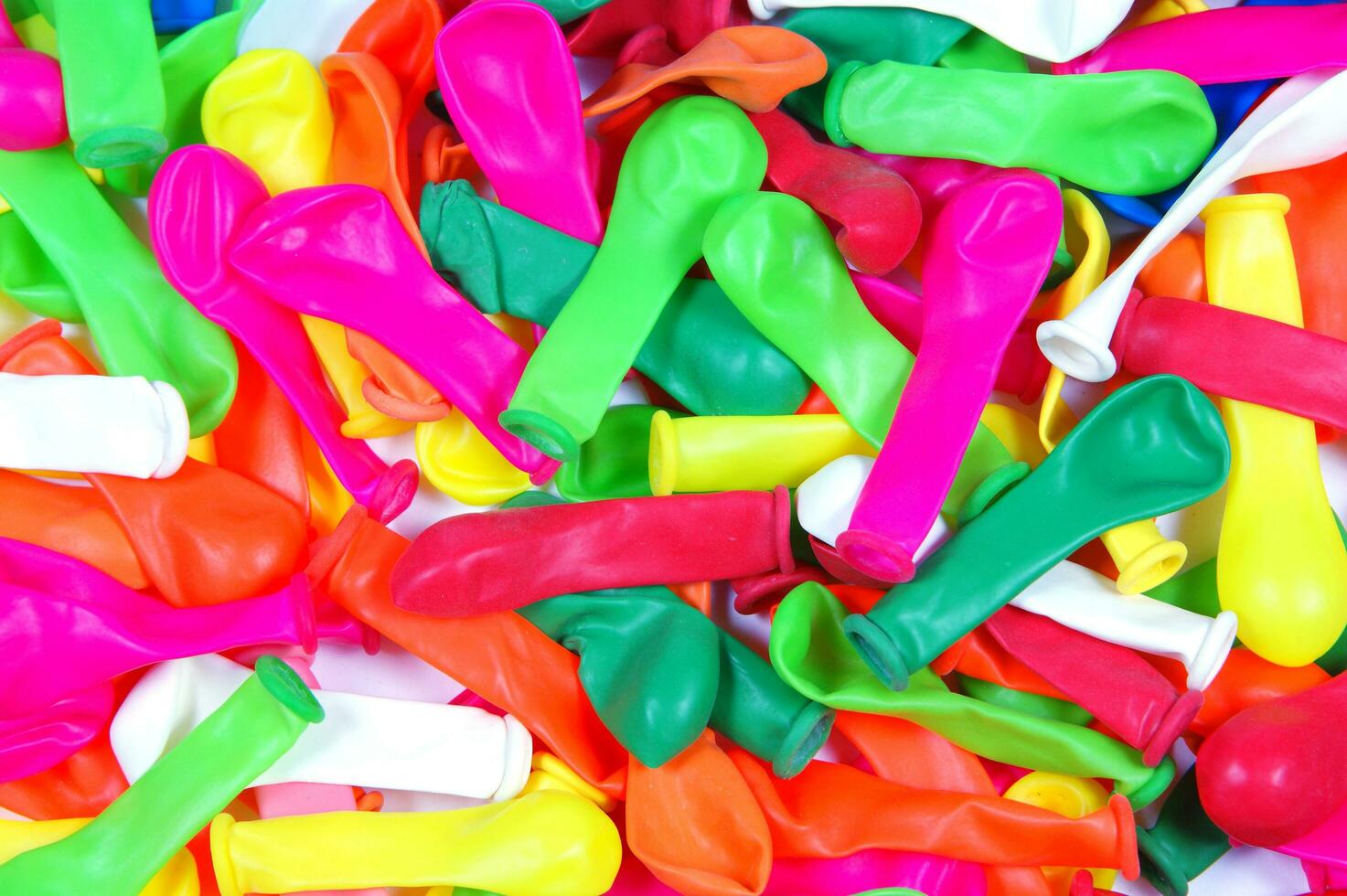 a pile of colorful plastic balloons photo