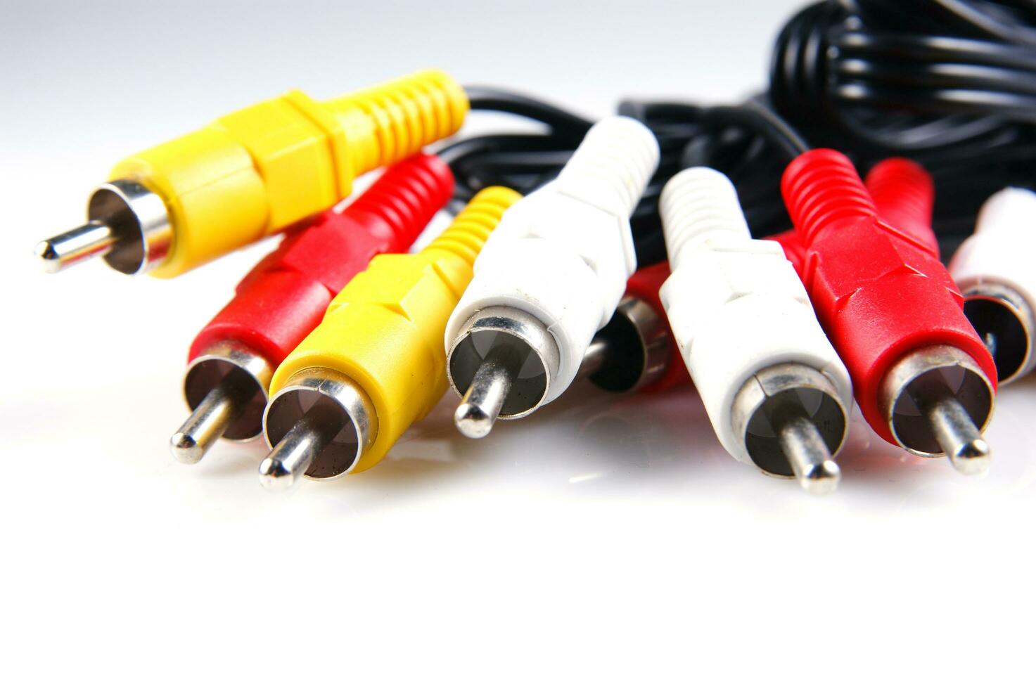 several different colored cables with different colored plugs photo