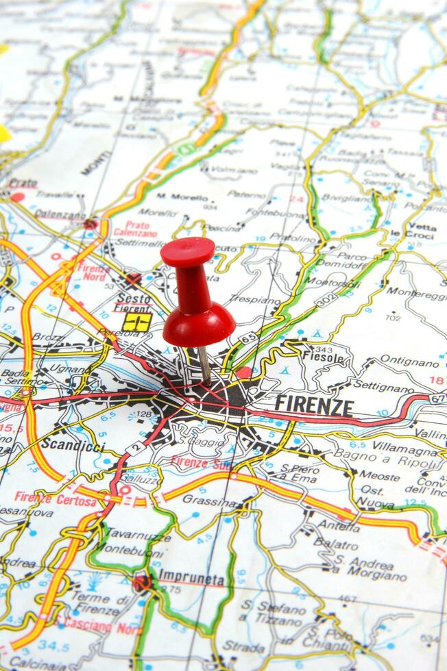 a red push pin is on a map of a city photo
