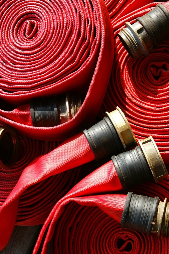a close up of a red fire hose photo