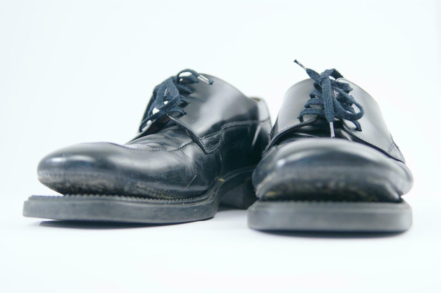 broken old black shoes photo