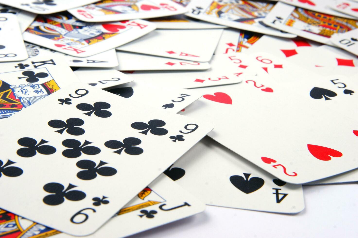 a pile of playing cards on a table photo