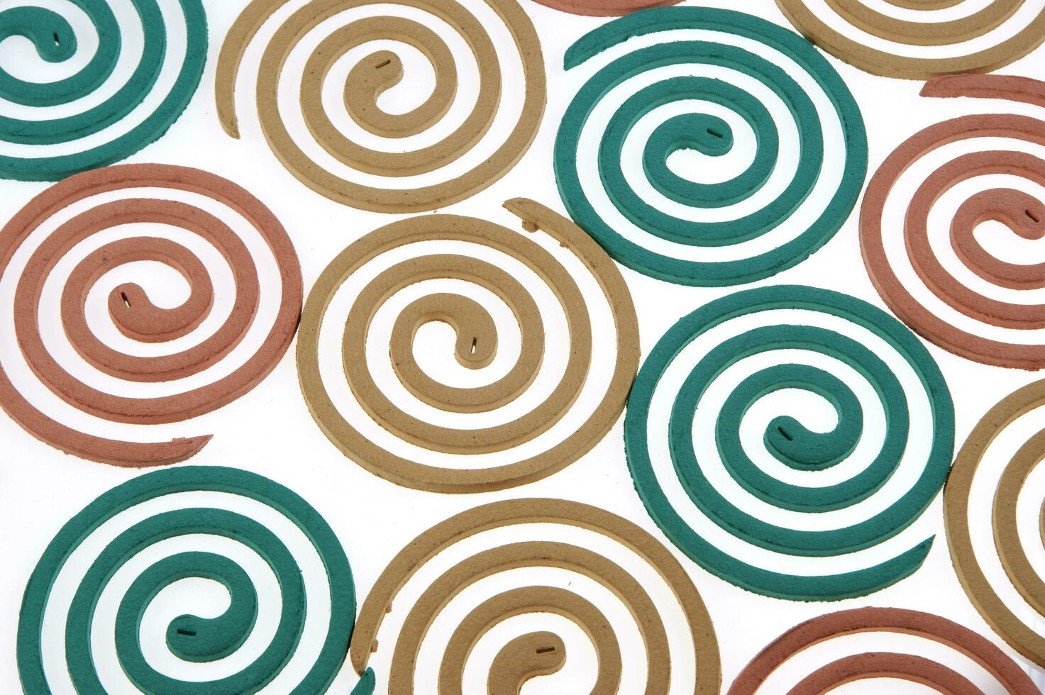a group of colorful coasters with a spiral design photo