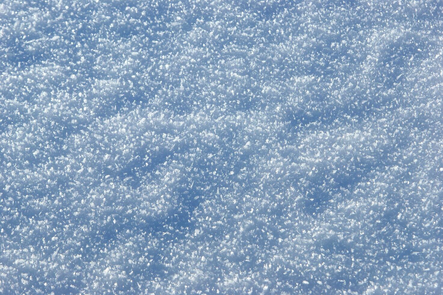 a close up of snow falling from the sky photo