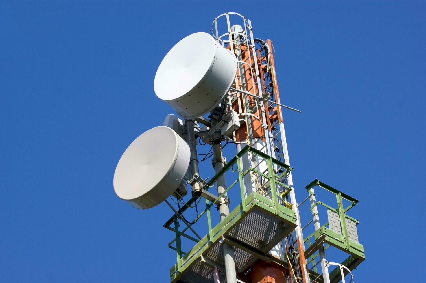 a cell phone tower with two antennas photo