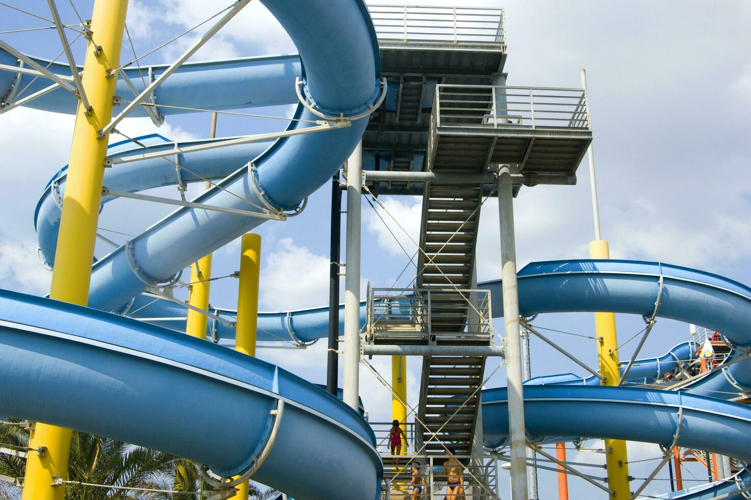 a blue slide in a water park photo