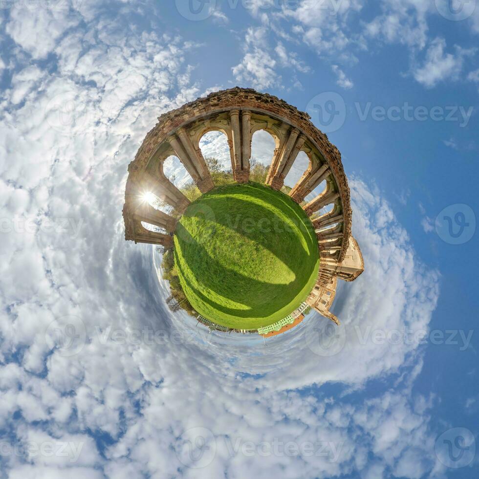 little planet and spherical aerial 360 panorama view on street ancient medieval castle with church and historic buildings with columns photo
