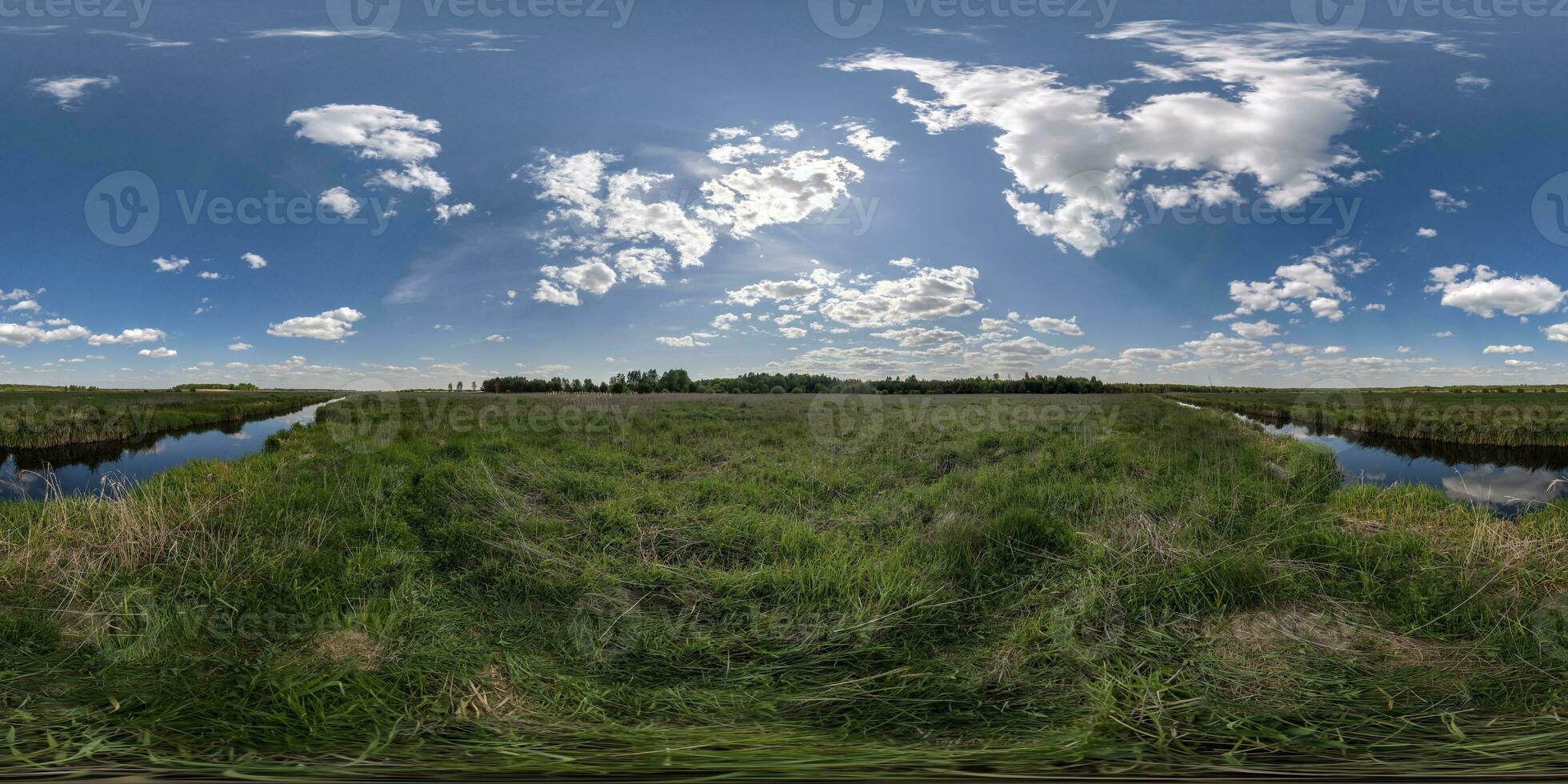 spherical 360 hdri panorama among green grass farming field near melioration reclamation canal in equirectangular seamless projection, as sky dome replacement, game development as skybox or VR content photo