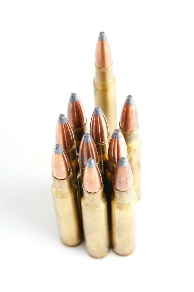 a row of bullet cartridges on a white background photo