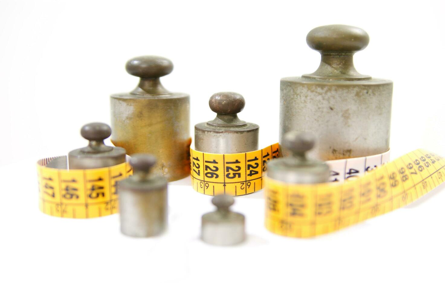 old weights for scales and tape measure to control the diet photo