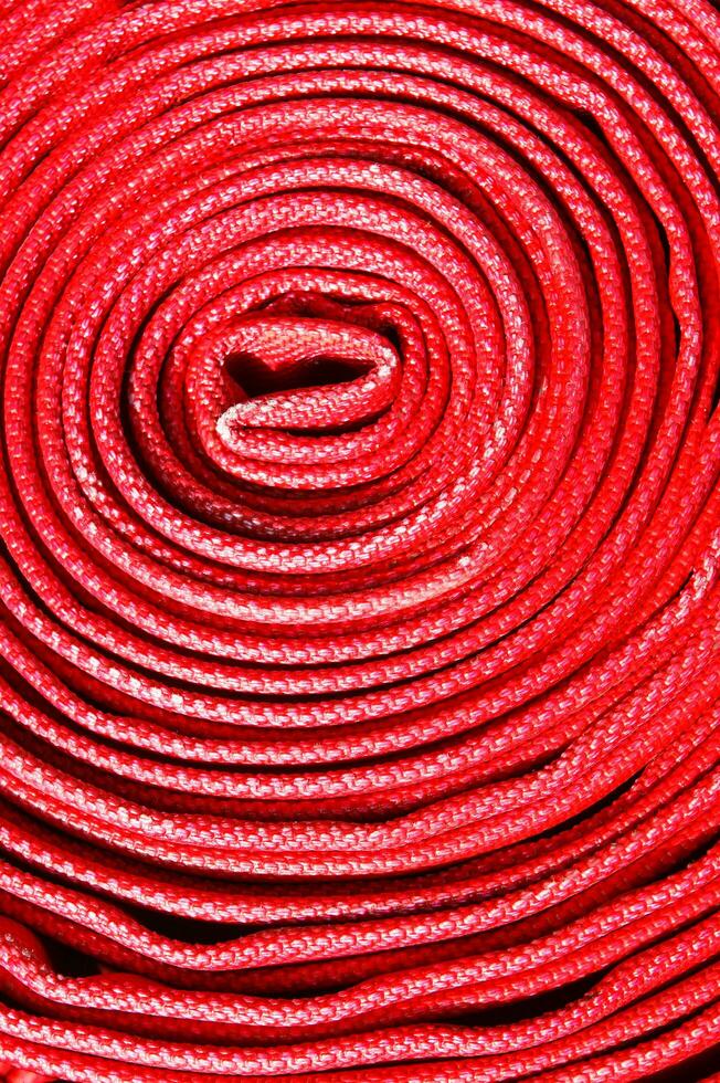 a close up of a red fire hose photo