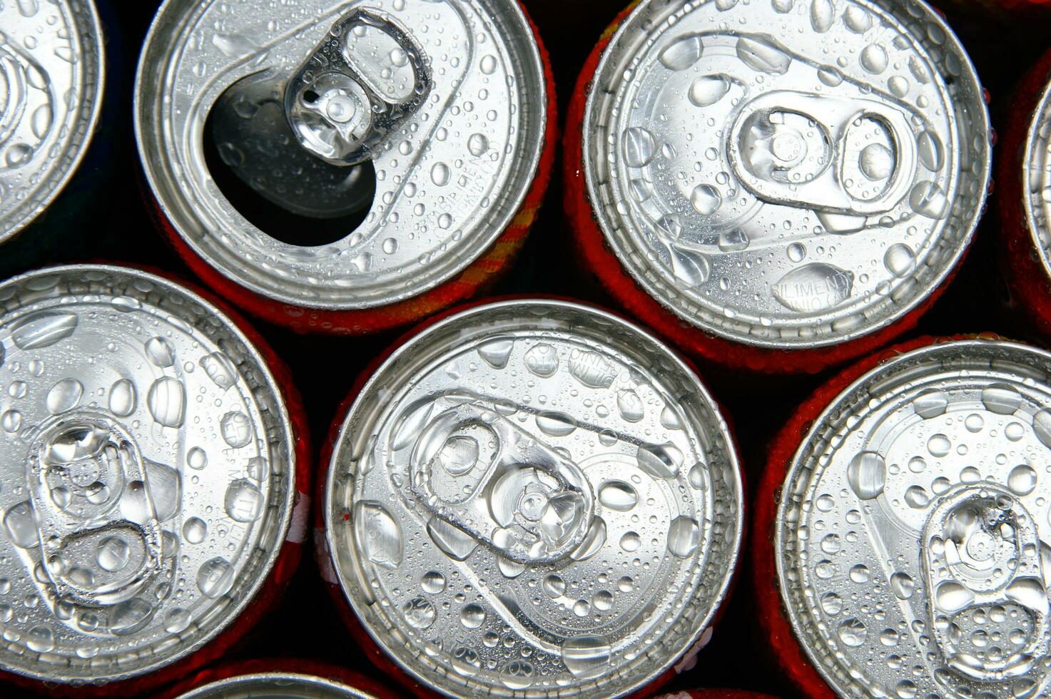 a close up of cans of soda photo