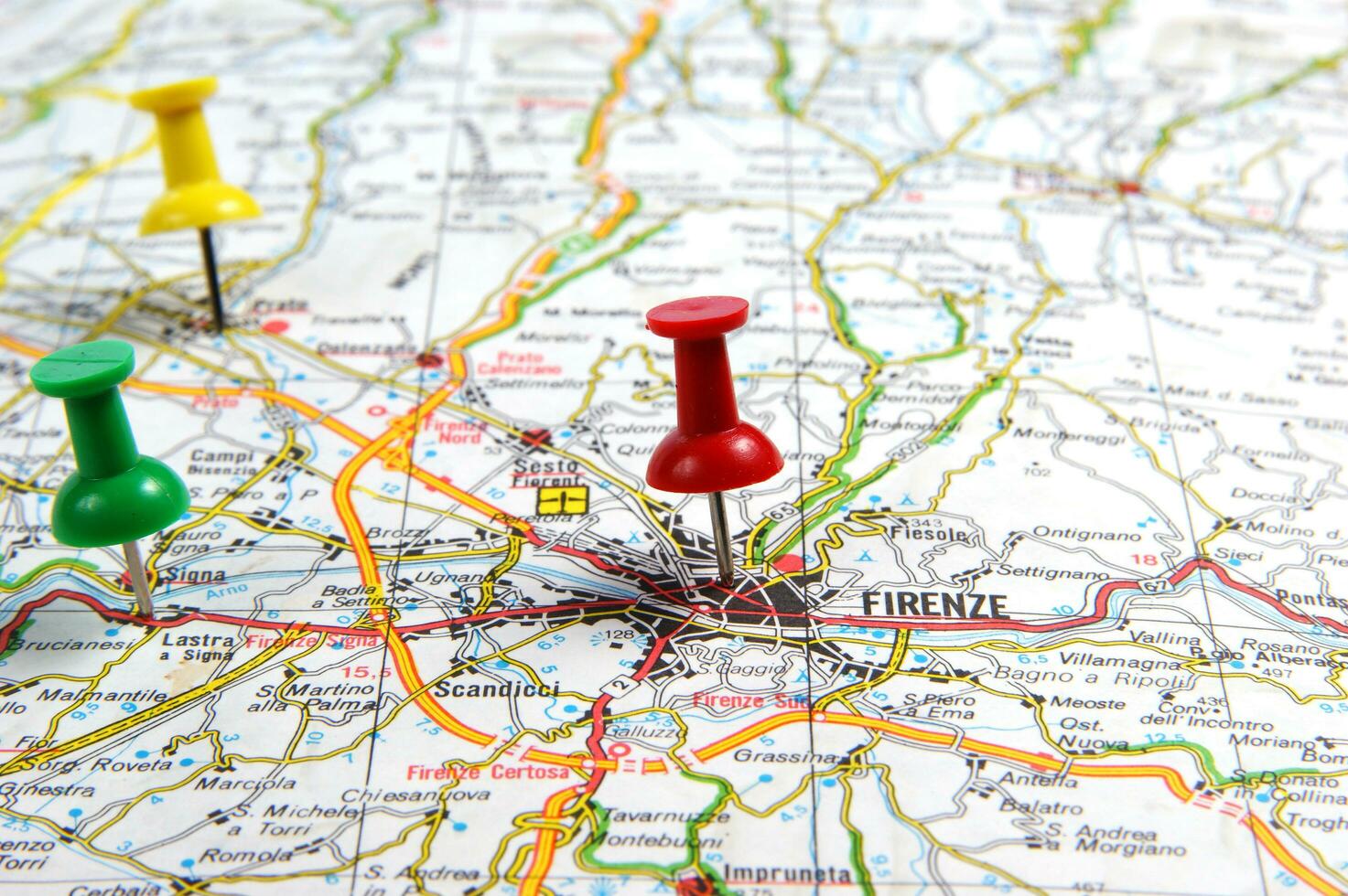 a red push pin is on a map of a city photo