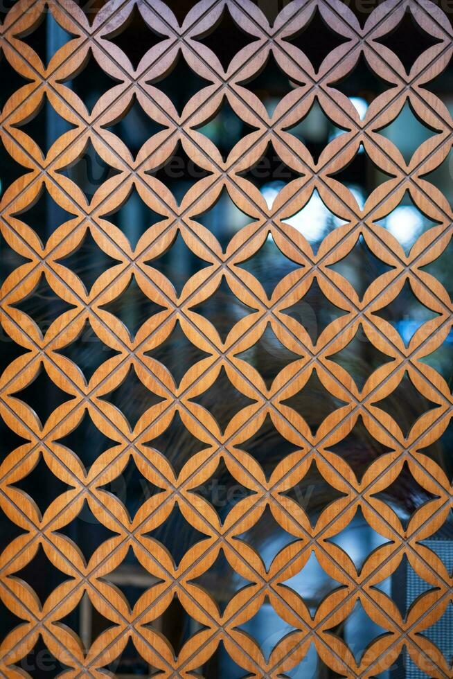 Wooden art patterned wall partition photo