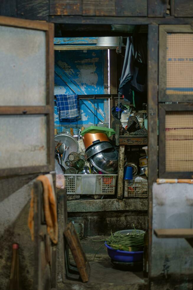 Pots, glasses, and kitchen utensils are arranged in the market kitchen. photo