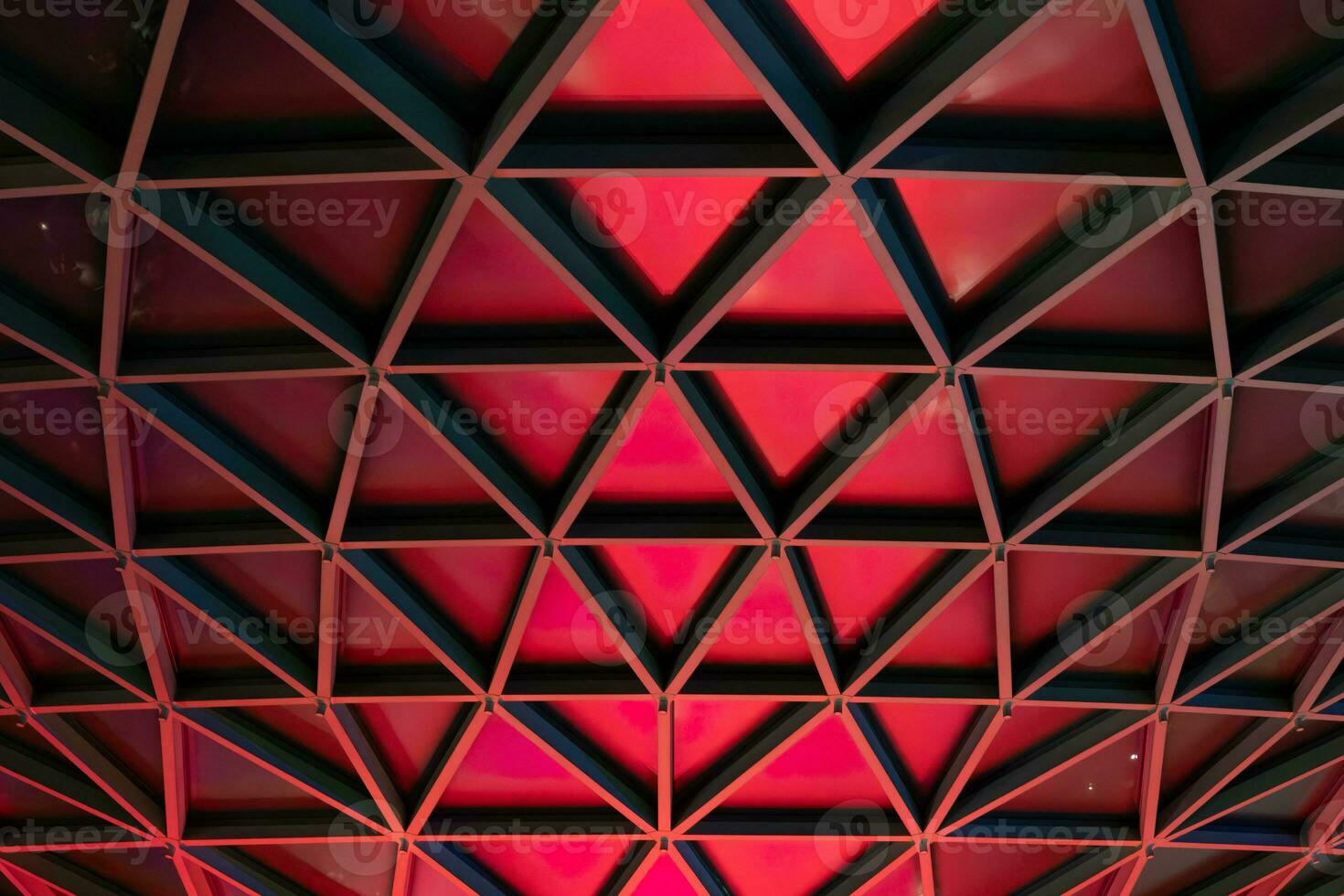 Abstract vortex architectural pattern of red triangles structure photo
