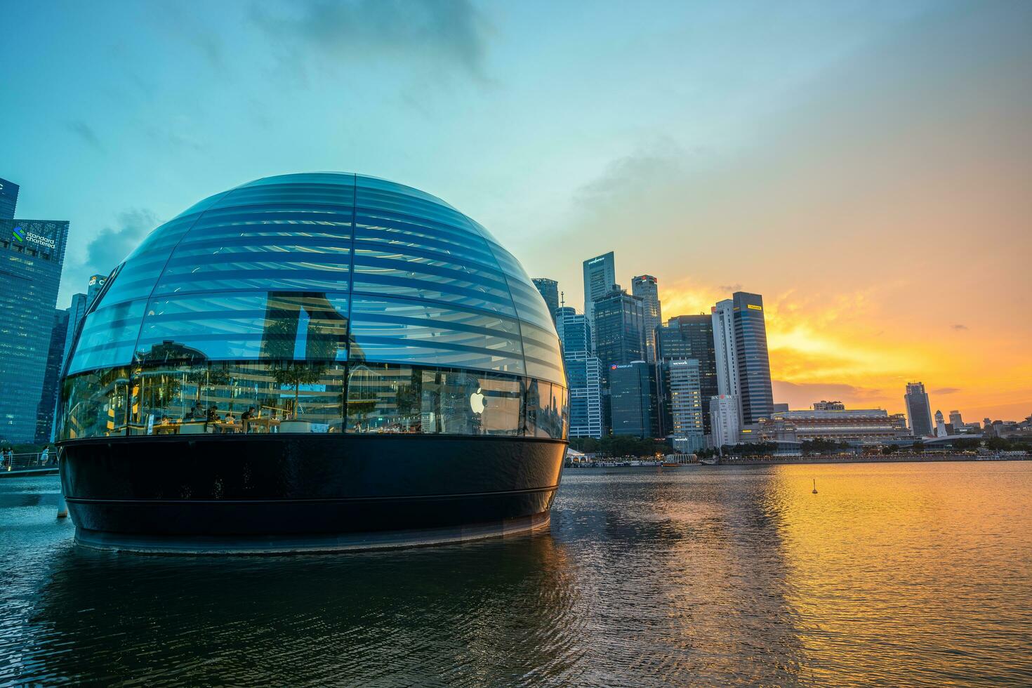 Singapore, August 14, 2023, Floating Apple store at Central Business District with sunset sky photo