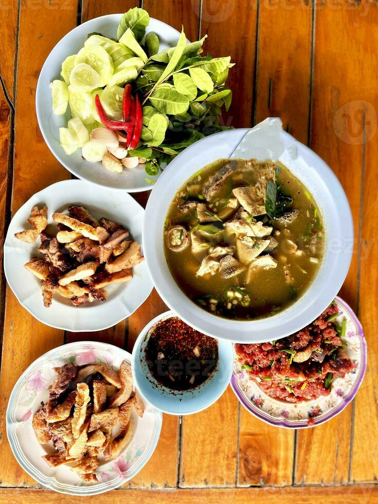 Raw beef cooks very tasty Thailand food. photo