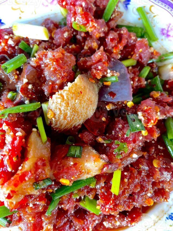Raw beef cooks very tasty Thailand food. photo